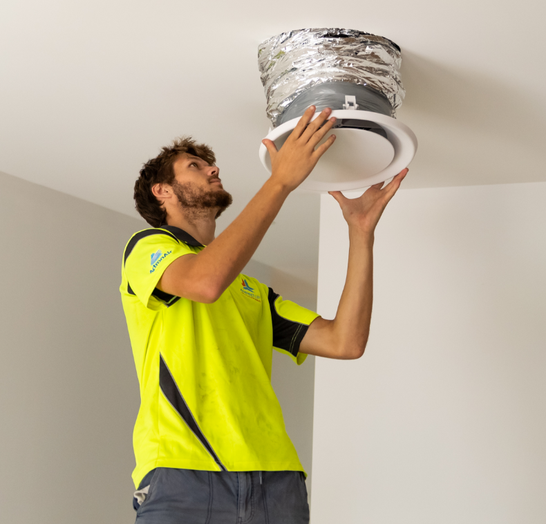Technician fitting a smart-controlled air vent